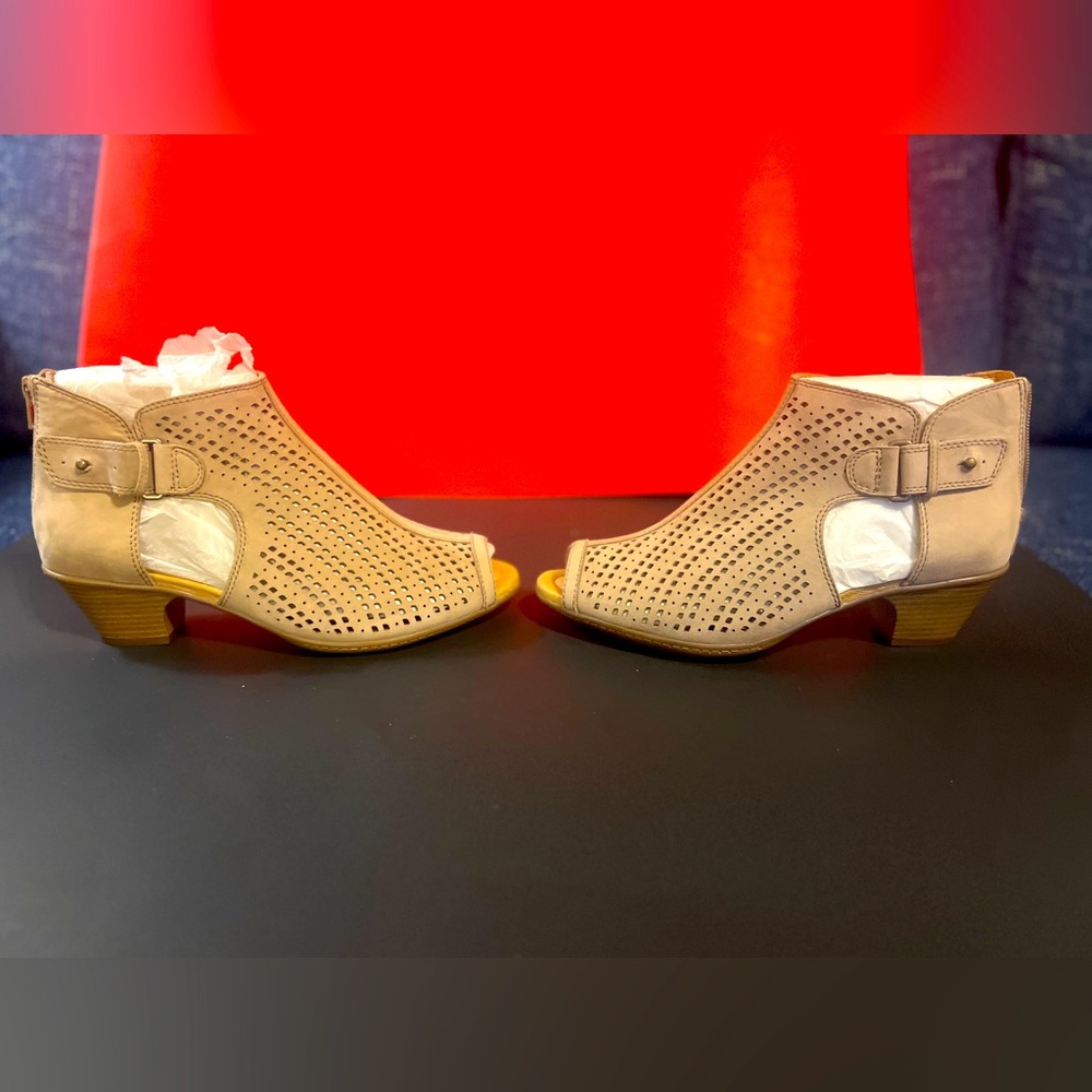 New without box. Earth open toe, heeled zip up back bootie. Size 9.